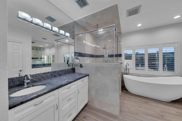 Bathroom, Dual Sink Vanities, Free Standing Baths, Glass Shower, Interior, Recessed Lighting, Wood Texture Flooring