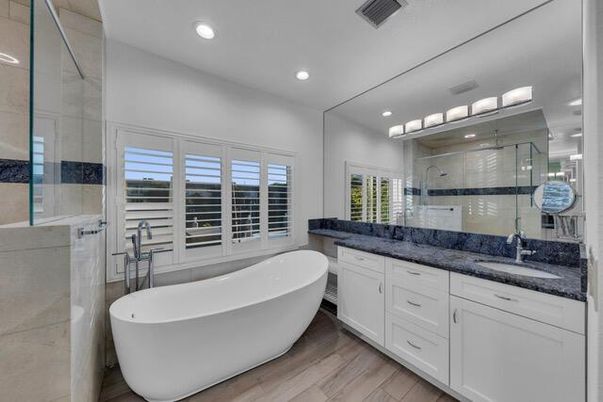 Bathroom, Dual Sink Vanities, Free Standing Baths, Glass Shower, Interior, Recessed Lighting, Wood Texture Flooring