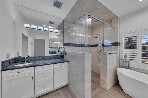 Bathroom, Dual Sink Vanities, Free Standing Baths, Glass Shower, Interior, Recessed Lighting, Wood Texture Flooring