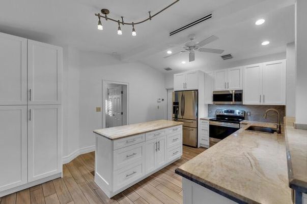 Interior, Kitchen, Recessed Lighting, Stainless Steel Appliances, Wood Texture Flooring
