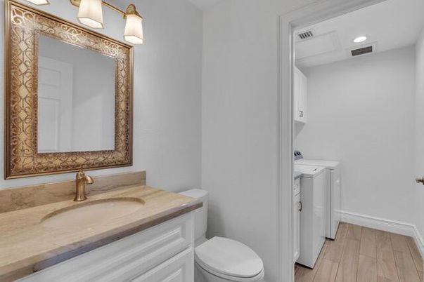 Bathroom, Interior, Recessed Lighting, Washer, Wood Texture Flooring