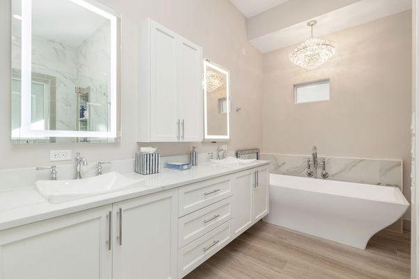 Bathroom, Chandelier, Dual Sink Vanities, Free Standing Baths, Interior, Marble Walls, Wood Texture Flooring