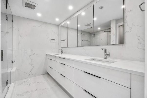 Bathroom, Dual Sink Vanities, Glass Shower, Interior, Marble, Marble Walls, Recessed Lighting, Walk-in Closets