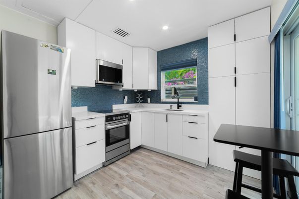 Interior, Kitchen, Recessed Lighting, Stainless Steel Appliances, Wood Texture Flooring