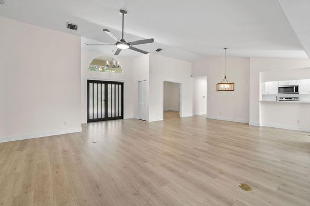 Empty room, Interior, Kitchen, Pendant Lights, Stainless Steel Appliances, Wood Texture Flooring