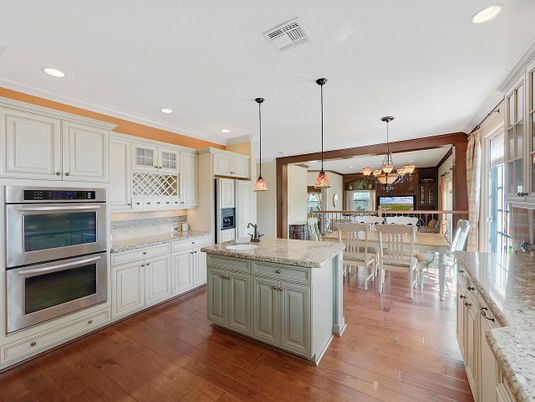 Chandelier, Dining room, Interior, Kitchen, Pendant Lights, Recessed Lighting, Stainless Steel Appliances, Wood Texture Flooring