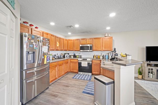Interior, Kitchen, Recessed Lighting, Stainless Steel Appliances, Wood Texture Flooring
