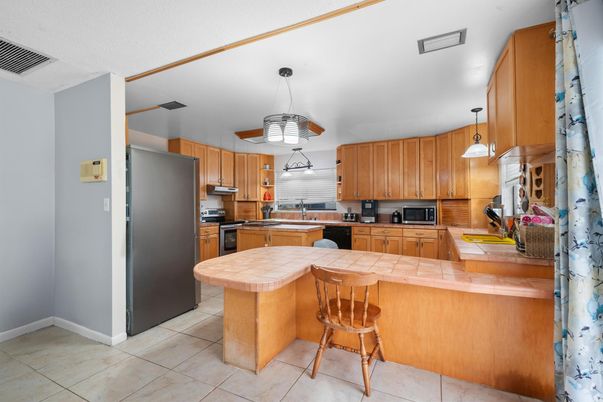 Interior, Kitchen, Pendant Lights, Stainless Steel Appliances, Tile Countertops