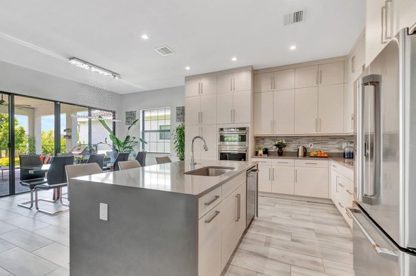 Chandelier, Dining room, Interior, Kitchen, Recessed Lighting, Stainless Steel Appliances, Wood Texture Flooring