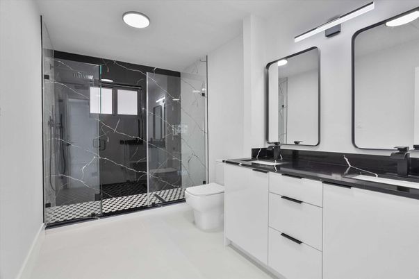 Bathroom, Dual Sink Vanities, Glass Shower, Interior, Marble Walls, Recessed Lighting