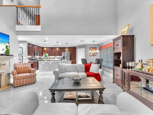 Chandelier, Dining room, Fireplace, Interior, Kitchen, Living room, Marble, Pendant Lights, Recessed Lighting, Stainless Steel Appliances