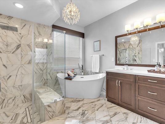 Bathroom, Chandelier, Dual Sink Vanities, Free Standing Baths, Glass Shower, Interior, Marble, Marble Walls, Recessed Lighting