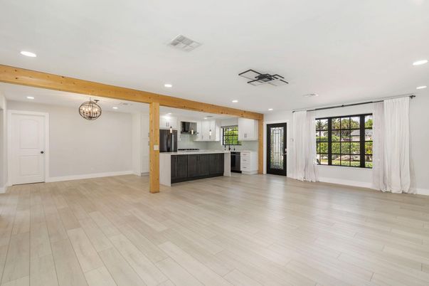 Chandelier, Empty room, Interior, Kitchen, Recessed Lighting, Stainless Steel Appliances, Wooden Beams, Wood Texture Flooring