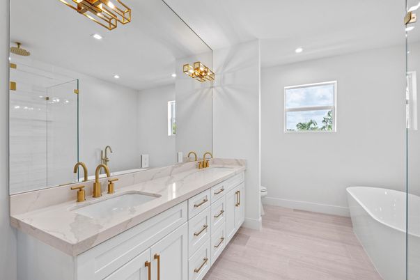 Bathroom, Dual Sink Vanities, Free Standing Baths, Glass Shower, Interior, Recessed Lighting, Wood Texture Flooring