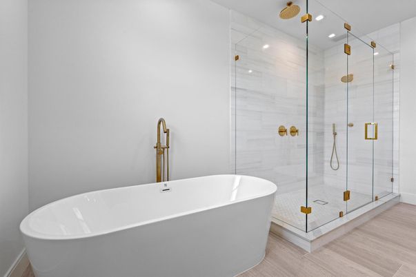 Bathroom, Free Standing Baths, Glass Shower, Interior, Marble Walls, Recessed Lighting, Wood Texture Flooring