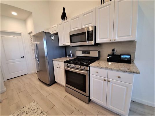 Interior, Kitchen, Recessed Lighting, Stainless Steel Appliances, Wood Texture Flooring