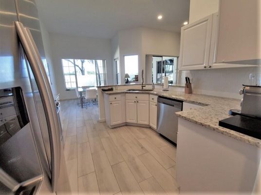 Dining room, Interior, Kitchen, Recessed Lighting, Stainless Steel Appliances, Wood Texture Flooring