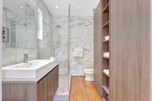 Bathroom, Glass Shower, Interior, Marble Walls, Recessed Lighting, Wood Texture Flooring