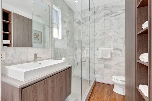 Bathroom, Glass Shower, Interior, Marble Walls, Recessed Lighting, Wood Texture Flooring