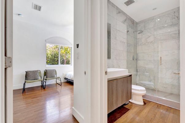 Bathroom, Glass Shower, Interior, Marble Walls, Recessed Lighting, Wood Texture Flooring
