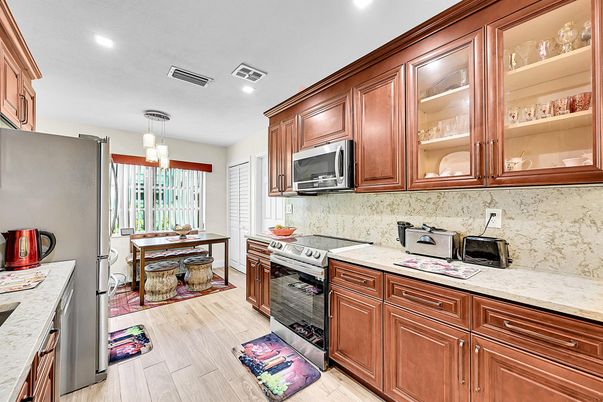 Chandelier, Dining room, Interior, Kitchen, Recessed Lighting, Stainless Steel Appliances, Wood Texture Flooring