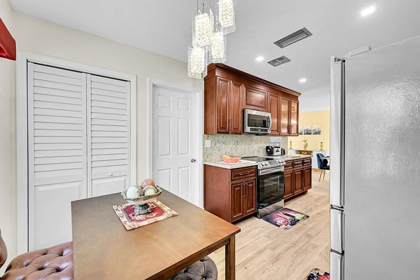 Chandelier, Interior, Kitchen, Recessed Lighting, Stainless Steel Appliances, Wood Texture Flooring