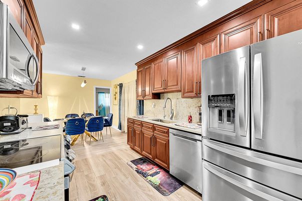 Dining room, Interior, Kitchen, Pendant Lights, Recessed Lighting, Stainless Steel Appliances, Wood Texture Flooring