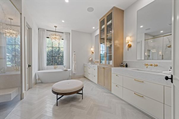 Bathroom, Chandelier, Dual Sink Vanities, Free Standing Baths, Glass Shower, Interior, Pendant Lights, Recessed Lighting, Wood Texture Flooring