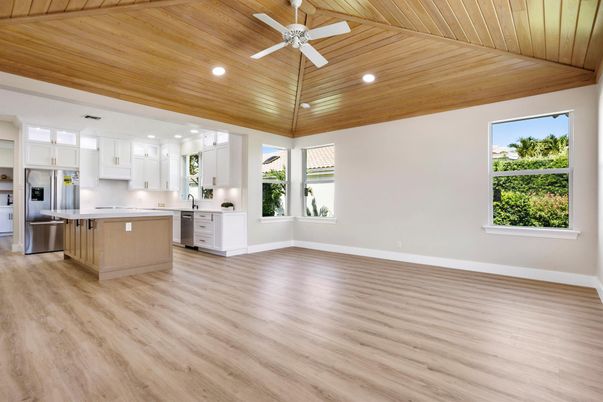 Empty room, Interior, Kitchen, Recessed Lighting, Stainless Steel Appliances, Wooden Ceilings, Wood Texture Flooring