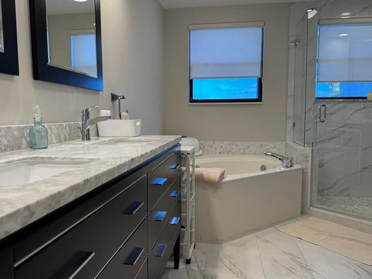 Bathroom, Dual Sink Vanities, Glass Shower, Interior, Marble, Marble Walls, Recessed Lighting