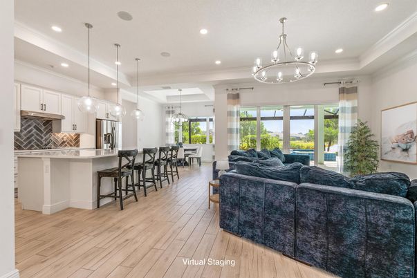 Chandelier, Interior, Kitchen, Living room, Pendant Lights, Recessed Lighting, Stainless Steel Appliances, Wood Texture Flooring