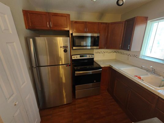 Interior, Kitchen, Stainless Steel Appliances, Tile Countertops, Wood Texture Flooring