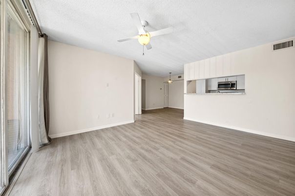Empty room, Interior, Kitchen, Pendant Lights, Stainless Steel Appliances, Wood Texture Flooring