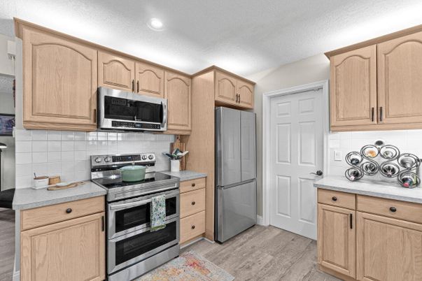 Interior, Kitchen, Recessed Lighting, Stainless Steel Appliances, Wood Texture Flooring