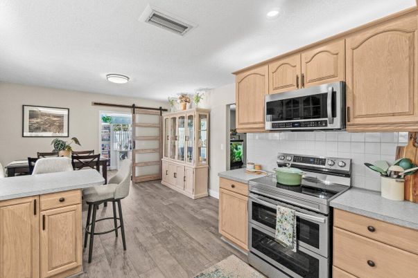 Dining room, Interior, Kitchen, Recessed Lighting, Stainless Steel Appliances, Wood Texture Flooring