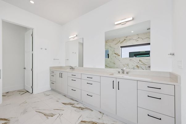 Bathroom, Dual Sink Vanities, Interior, Marble, Marble Walls, Recessed Lighting