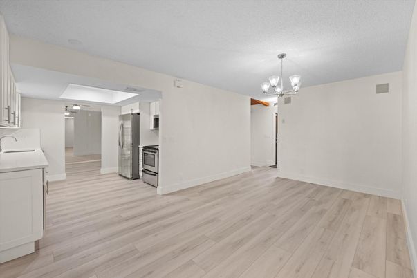 Chandelier, Empty room, Interior, Kitchen, Stainless Steel Appliances, Wood Texture Flooring