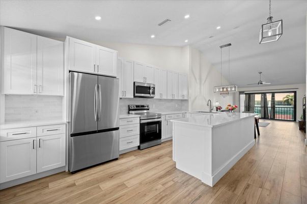 Interior, Kitchen, Pendant Lights, Recessed Lighting, Stainless Steel Appliances, Wood Texture Flooring