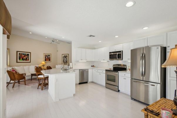 Dining room, Interior, Kitchen, Living room, Recessed Lighting, Stainless Steel Appliances, Wood Texture Flooring