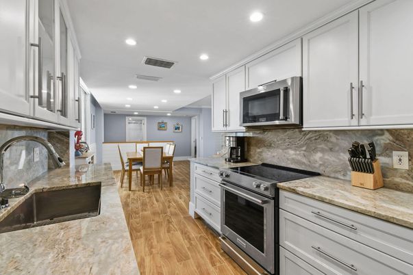 Dining room, Interior, Kitchen, Recessed Lighting, Stainless Steel Appliances, Wood Texture Flooring