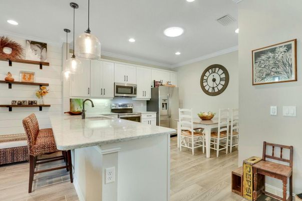 Dining room, Interior, Kitchen, Pendant Lights, Recessed Lighting, Stainless Steel Appliances, Wood Texture Flooring