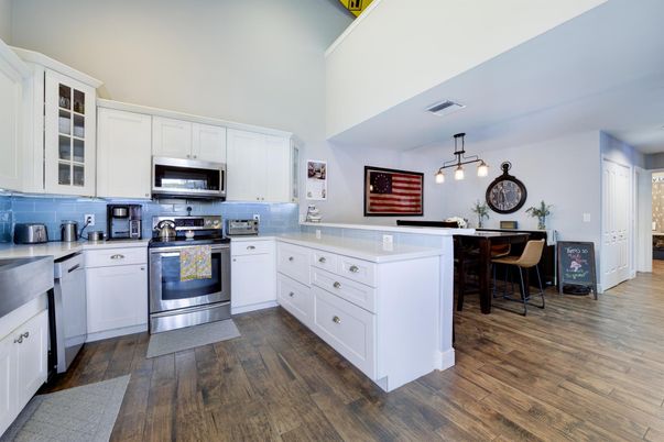Dining room, Interior, Kitchen, Pendant Lights, Stainless Steel Appliances, Wood Texture Flooring