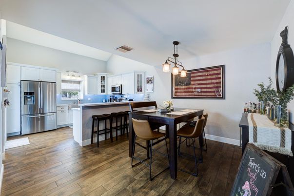 Dining room, Interior, Kitchen, Pendant Lights, Stainless Steel Appliances, Wood Texture Flooring