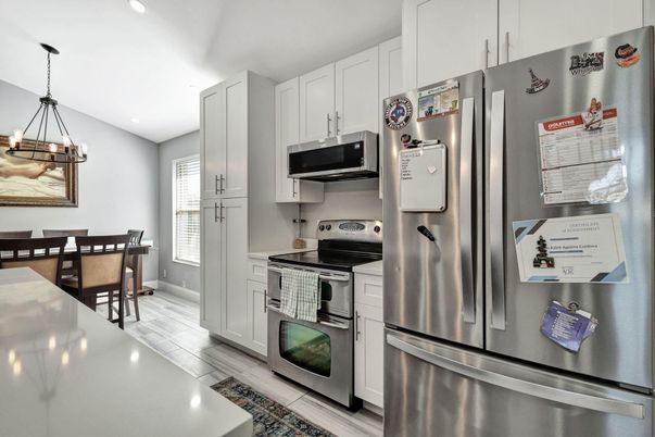 Dining room, Interior, Kitchen, Pendant Lights, Recessed Lighting, Stainless Steel Appliances, Wood Texture Flooring