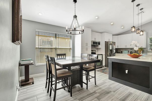 Chandelier, Dining room, Interior, Kitchen, Pendant Lights, Recessed Lighting, Stainless Steel Appliances, Wood Texture Flooring