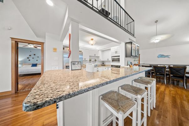Dining room, Interior, Kitchen, Pendant Lights, Recessed Lighting, Stainless Steel Appliances, Wood Texture Flooring