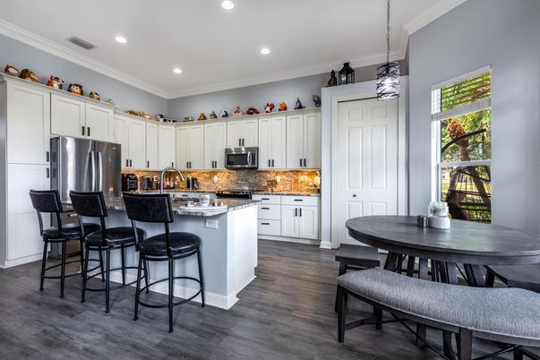 Dining room, Interior, Kitchen, Pendant Lights, Recessed Lighting, Stainless Steel Appliances, Wood Texture Flooring