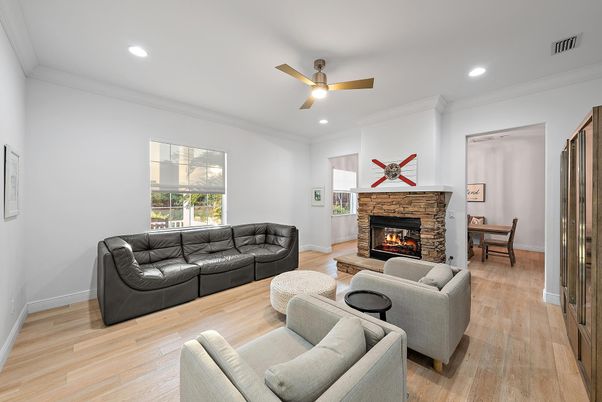 Dining room, Fireplace, Interior, Living room, Recessed Lighting, Wood Texture Flooring