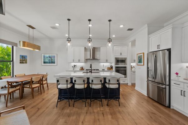 Dining room, Interior, Kitchen, Pendant Lights, Recessed Lighting, Stainless Steel Appliances, Wood Texture Flooring