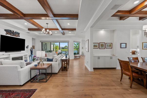 Chandelier, Dining room, Fireplace, Interior, Living room, Recessed Lighting, Wooden Beams, Wood Texture Flooring
